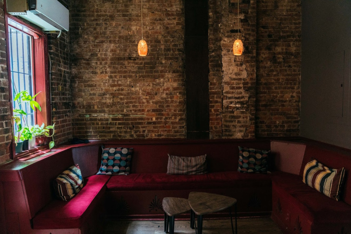 Interior, separated seating area, bare-brick walls