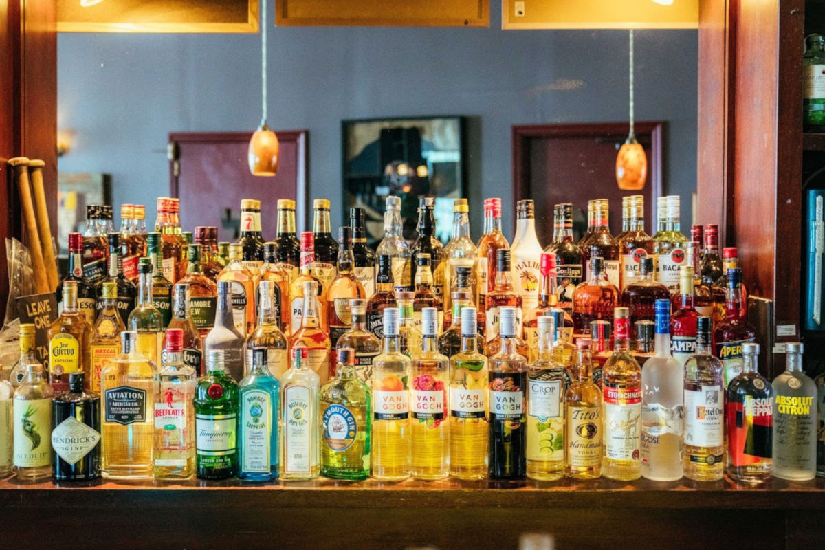 Numerous bottles stacked behind the bar